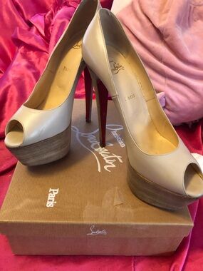 Christian Louboutin Ivory Peep-Toe Platform Pumps with Red Soles